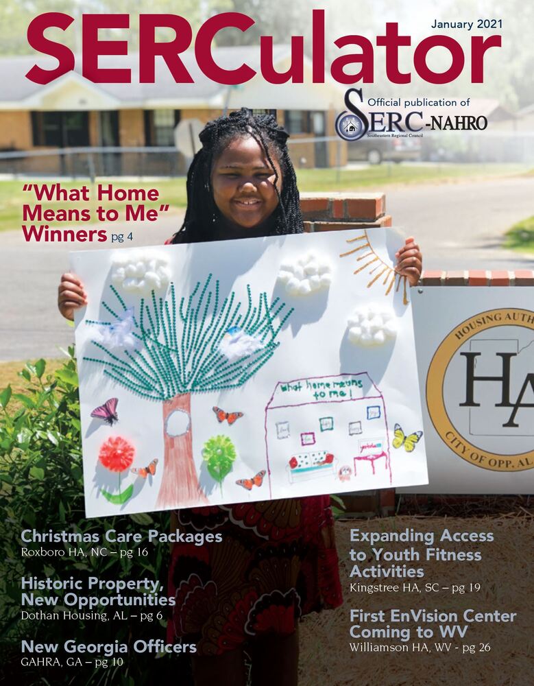 Magazine Cover Jan 2021 Girl holding her artwork in front of Opp Housing Authority