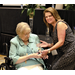 Two women standing together one receiving an award