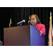 A woman standing at a podium 