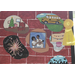 a brick wall with various holes cut in it with scenes from throughout the year, first day of school, Christmas, 4th of July, birthdays, and graduations. There there is a hole in the center that features a family photo