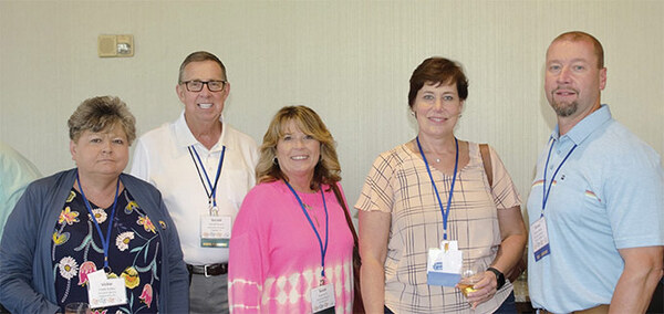 Pg14KentuckyHAGroupPhoto.jpg A group of people standing together smiling at the camera