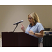 A woman speaking at a podium 