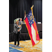 a woman displaying the Georgia state flag