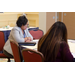 Ivory Mathews, CEO (Columbia, SC) sits at a table and looks down at her notes.