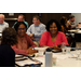 Carmen Maniak, Director of Leased Housing (Charleston Kanawha, WV), Shana Demby, ED (Enterprise, AL), Doris Richardson, ED (Greensboro, AL) sit at a table together.