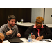 A man and Reta Thomas, Resident Services Director (Augusta, GA) sit at a table together.