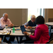 2 men and Ivory Mathews, CEO (Columbia, SC) sit at a table together.