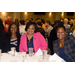Ivory Mathews, CEO (Columbia, SC) and two other women sit at a table together and smile.