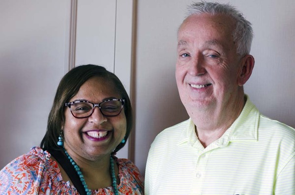 President & CEO Shaundra Clark smiling and standing next to Executive Director Jake Oglesby