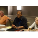 Commissioner Johnny Johnson sitting at a table with others