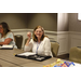 Commissioner Brenda Honeycutt sitting at a table smiling