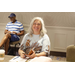 Advisor Cindy Preast Harrington sitting at a table smiling