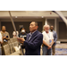 Executive Director Michael Wong holding a flag pole