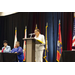 Executive Director Evette Hester standing on stage behind a podium 