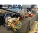 A table full of giftwrapped baskets up for auction.