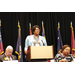  A woman speaking at a podium. 