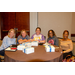 A group of individuals sitting at a dinner table.