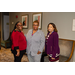 Three women standing together for a photo.