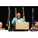  A women standing behind a podium.  