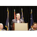  A man standing behind a podium. 