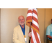  A man holding the American flag. 