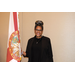 A woman holding the Florida state flag.