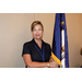 A woman holding the Kentucky state flag.