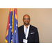 A man holding the Mississippi state flag.