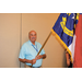  A man holding the North Carolina State flag. 