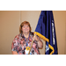 A woman holding the South Carolina state flag.