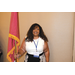 A woman holding the Tennessee state flag.