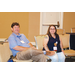 A man and a woman sitting on a couch.