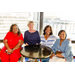  Four women sitting around a circular table at the President's Welcome Reception. 