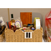  A view of raffle basket Number 11. Honey sticks, bottle of wine, pasta, spaghetti sauce, honey, crackers, and wine glasses. 