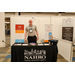  Greg stands and smiles at the NAHRO booth. Building communities together. 