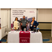  A man and two women stand and smile at the AMA booth. Creating a better way to advance people and performance. Your agency of choice in management, consulting and compliance. 