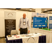  A man stands and smiles at the HART booth. Housing Agency Retirement Trust. A retirement plan you can trust since 1970. 