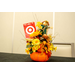  A gift prize that includes a pumpkin with flowers, a scarecrow, and a target gift card on it. 